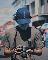 Portrait of man photographing