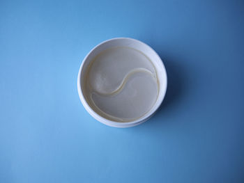 High angle view of drink against blue background