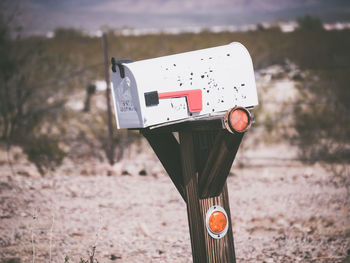 Close-up of mailbox on land