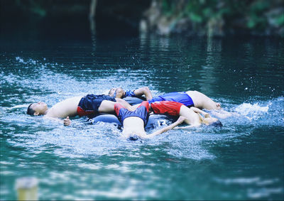 People swimming in water