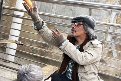 Homeless man receiving bread