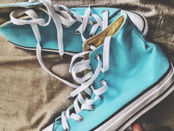 Close-up of shoes on fabric