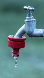 Close-up of water drop of faucet