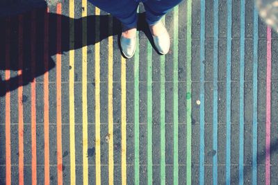 Low section of man standing on floor