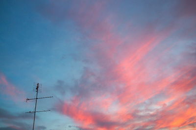 Low angle view of cloudy sky at sunset