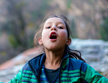 Portrait of cute girl looking up