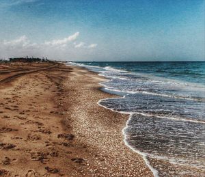 Scenic view of beach against sky