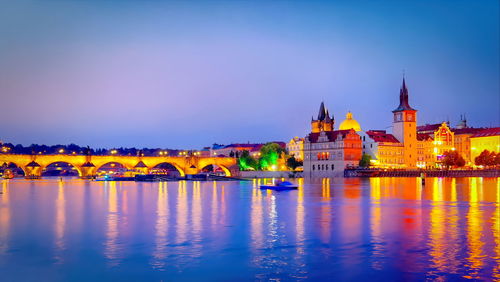 Illuminated buildings at waterfront