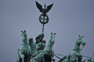 Low angle view of statue against sky