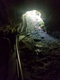 Man in illuminated tunnel