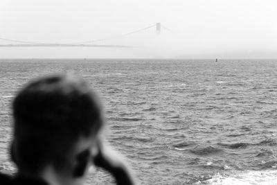 Rear view of man in sea