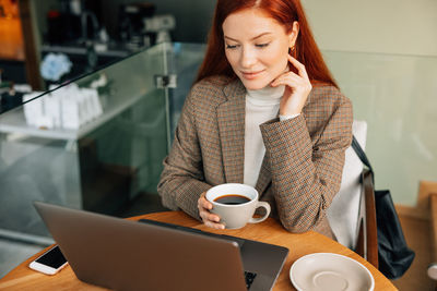 Young woman using mobile phone