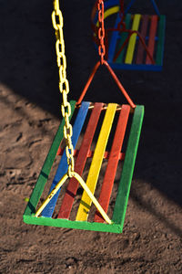 Multi-color painted swing for child on playground