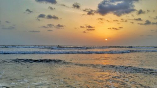 Scenic view of sea at sunset