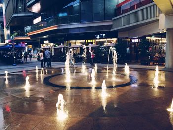 Blurred motion of people in city at night