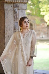 Portrait of beautiful young woman standing outdoors