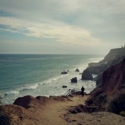 Scenic view of sea against cloudy sky