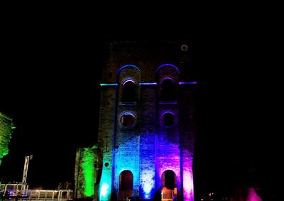 Low angle view of illuminated building at night