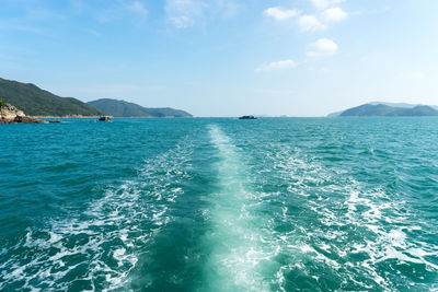 Scenic view of sea against blue sky