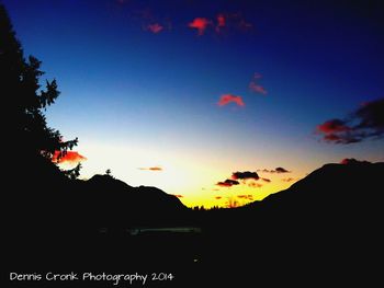 Scenic view of mountains against sky at sunset