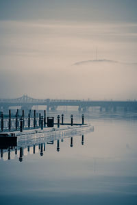 View of wooden posts in sea