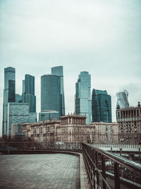 Modern buildings in city against sky