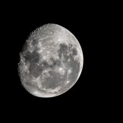 Low angle view of moon against clear sky at night