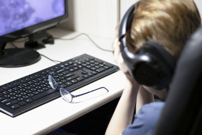 Close-up of using laptop on table