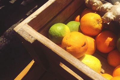 High angle view of fruits on wood