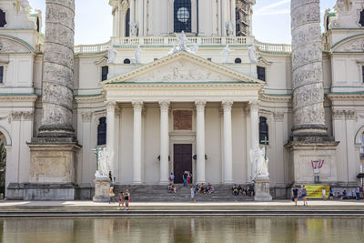 Group of people in front of historic building