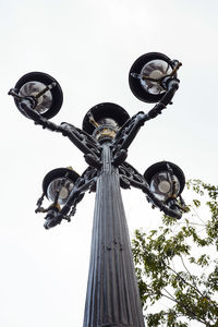 Low angle view of street light against clear sky