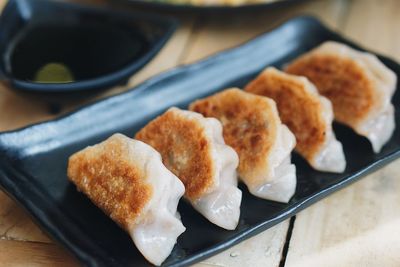 Close-up of dumplings in plate on table