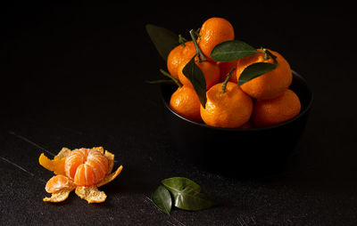 High angle view of orange on table against black background