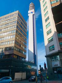 Low angle view of modern buildings in city against sky