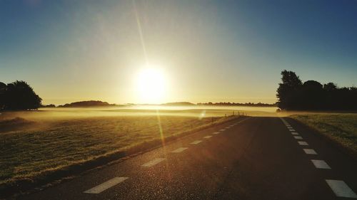 Empty road at sunset