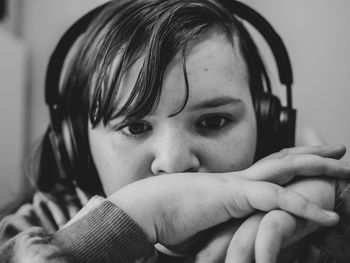 Close-up portrait of girl wearing headphones