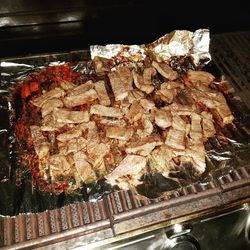 High angle view of meat on barbecue grill