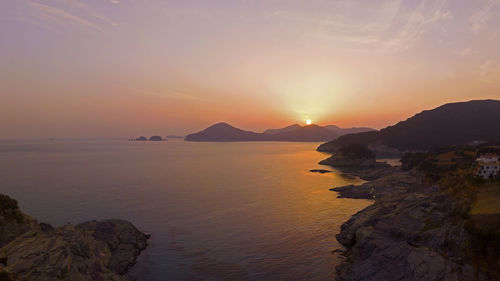 Scenic view of sea against sky during sunset