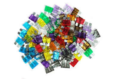 Directly above shot of multi colored pencils against white background