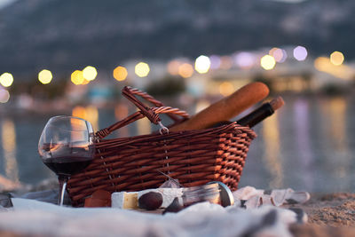 Close-up of food in basket at dusk