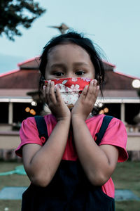 Portrait of girl standing outdoors