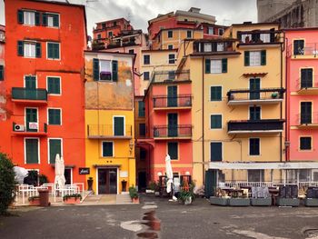 Multi colored residential buildings against sky