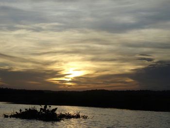 Scenic view of lake against sky during sunset