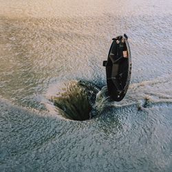 High angle view of flood water flowing into sewer