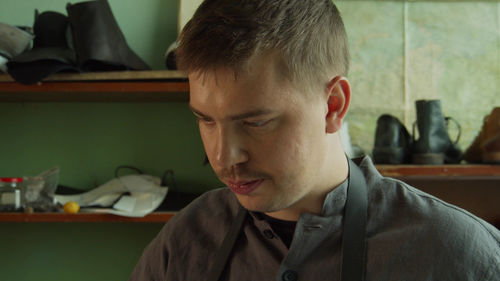 Close-up of young man looking down