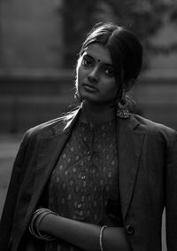 Portrait of young indian woman standing outdoors