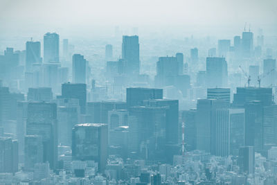 Modern buildings in city against sky