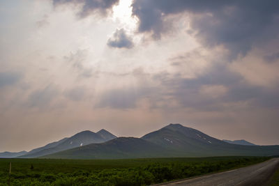 Scenic view of landscape and mountains against sky