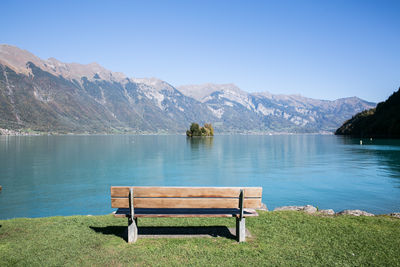 Scenic view of lake and mountains against clear sky