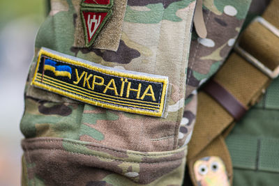 Flag of ukraine, ukrainian army or armed forces on a patch of a soldier military uniform, close up